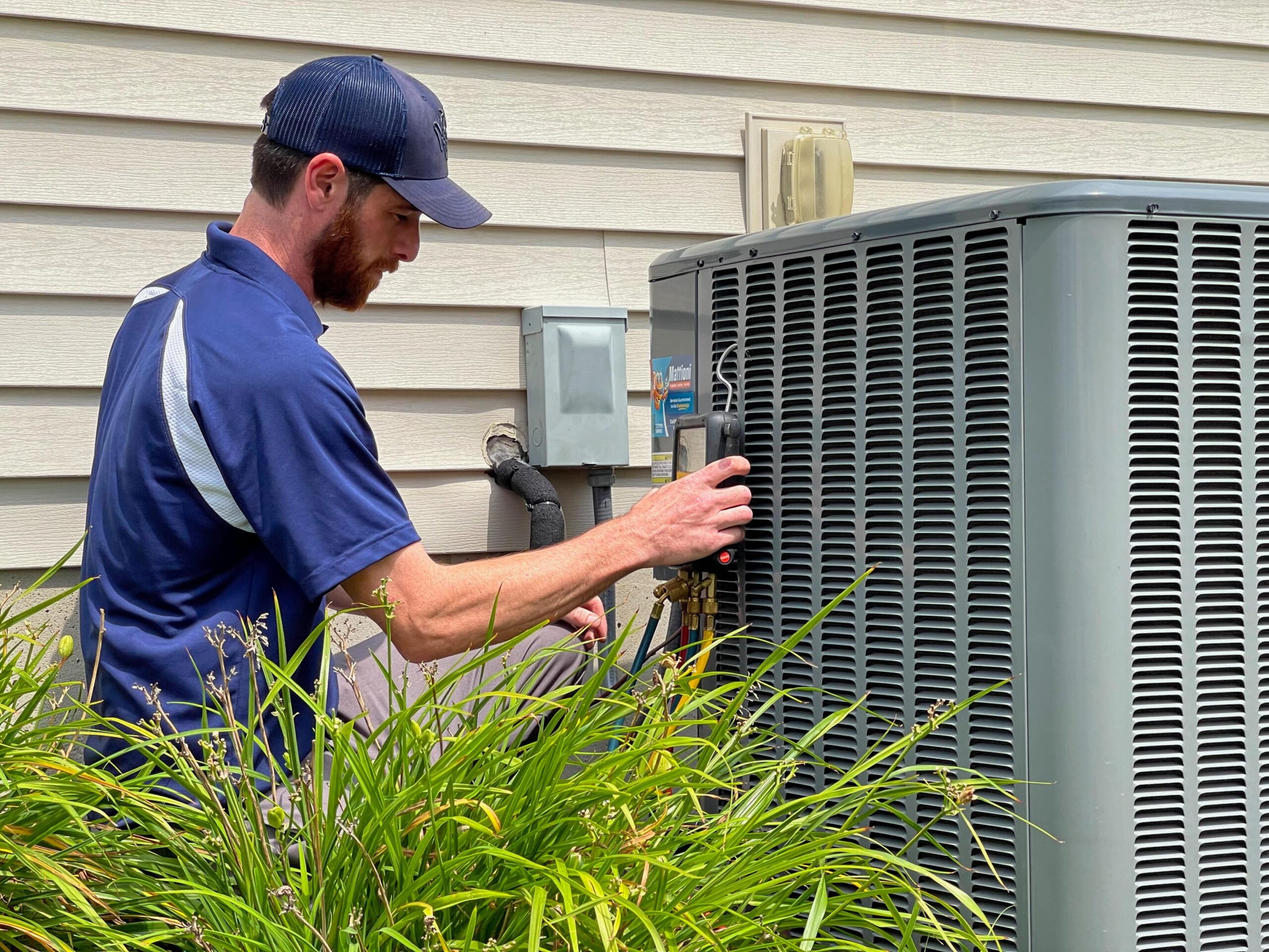 Technician performing test on an outside AC unit
