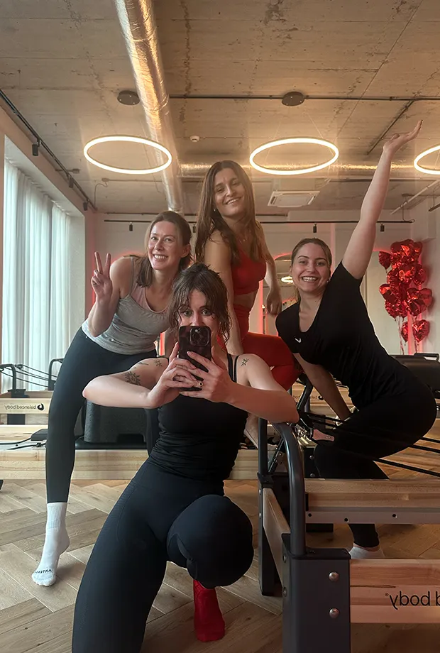 a group of women posing for a photo