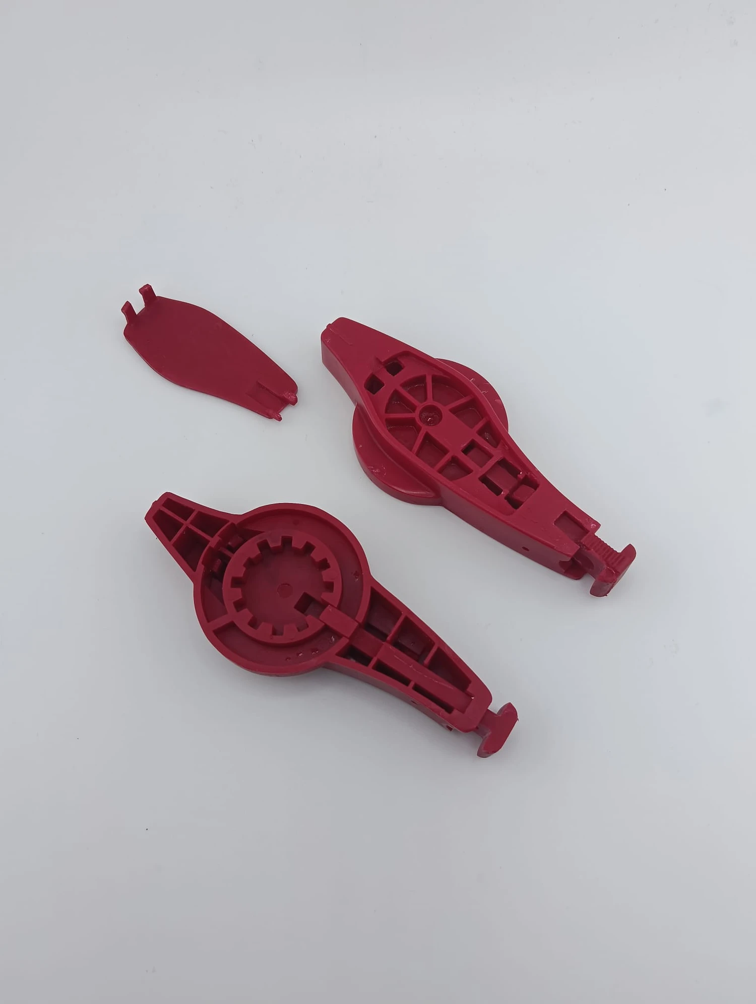 Individual vacuum cast switch components for Crittall Windows before assembly