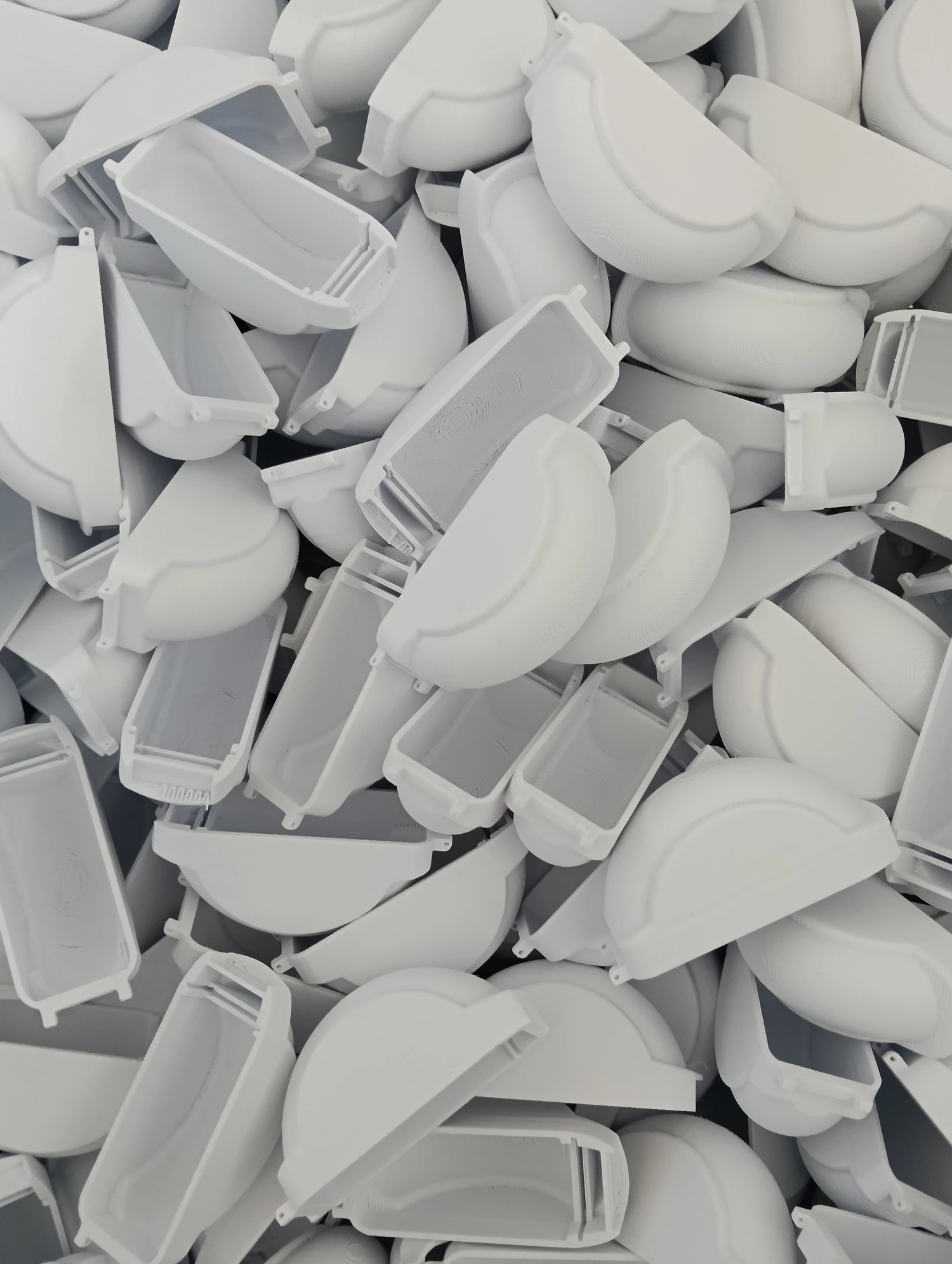 Loose printed housing halves for the 150 unit Papa Johns garlic gum run