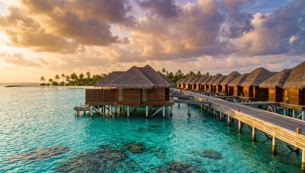 Maldives hero -- Overwater bungalows on a turquoise atoll