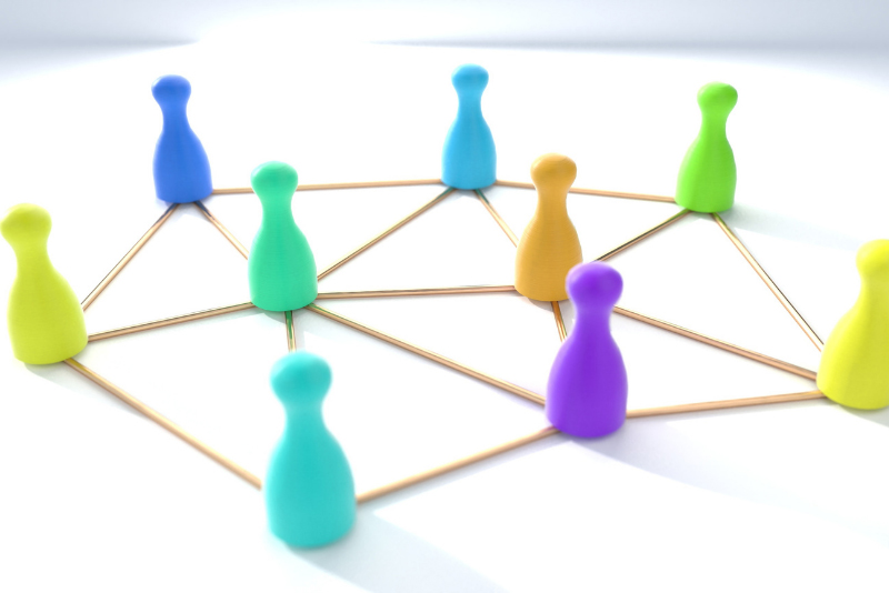 stock photo people game pieces connected by toothpicks