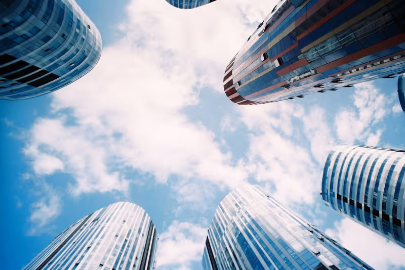 stock photo upward camera angle with tall glass buildings