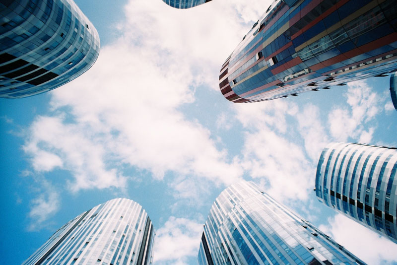 stock photo upward camera angle with tall glass buildings