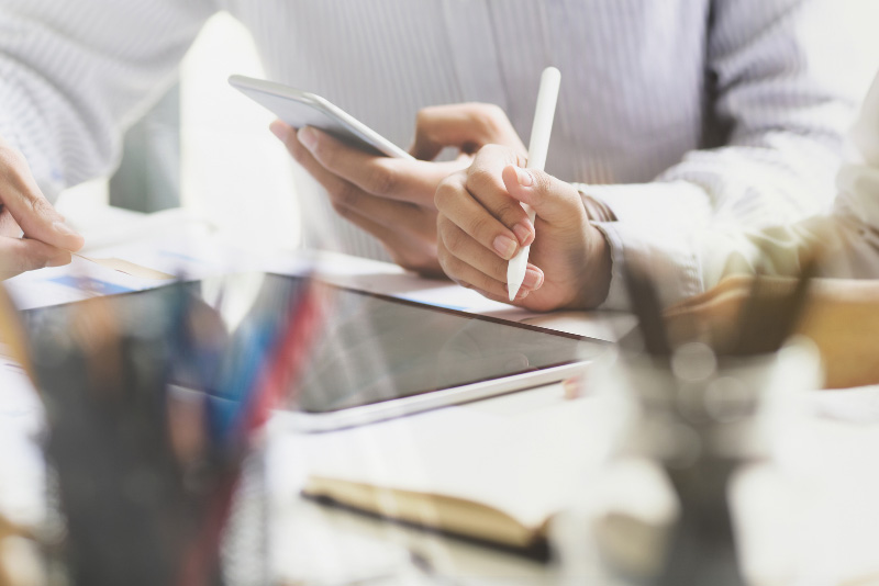 stock photo hands holding table pen and phone
