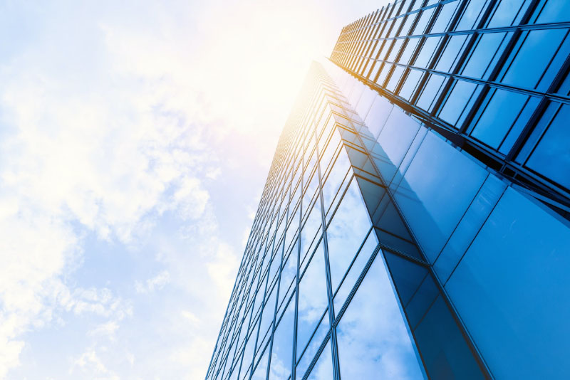 stock photo upward image of glass high rise building