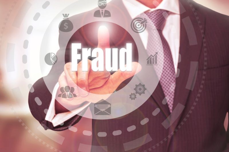 stock photo person touching screen with work fraud overlay
