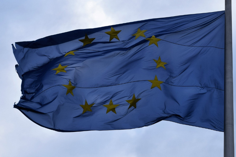 stock photo European Union flag with sun behind