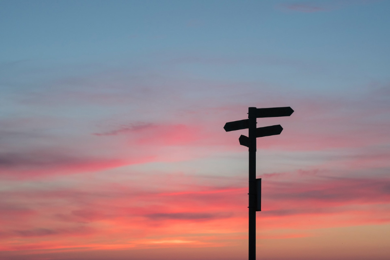 stock photo sign post with sunset behind
