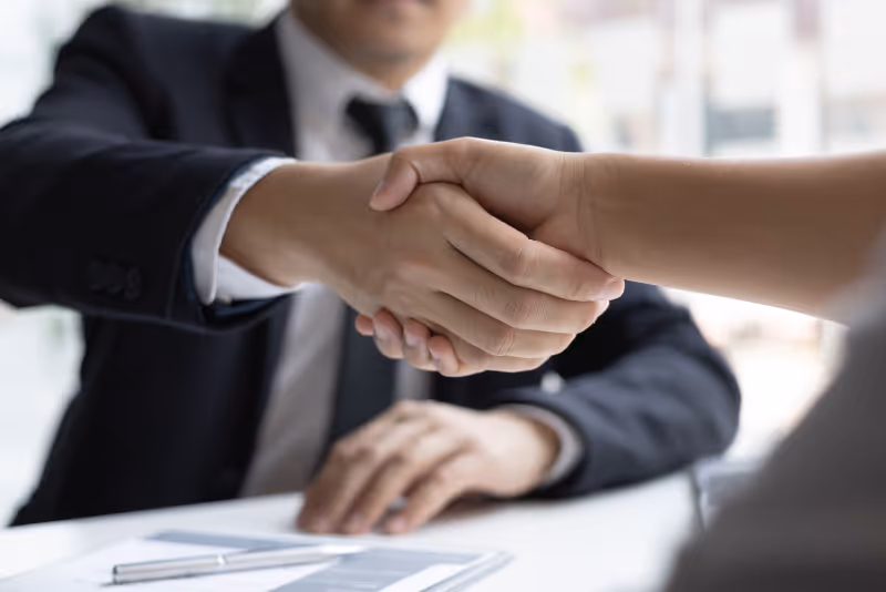 stock photo business professionals shaking hands