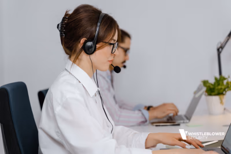 stock photo two people wearing headsets taking calls