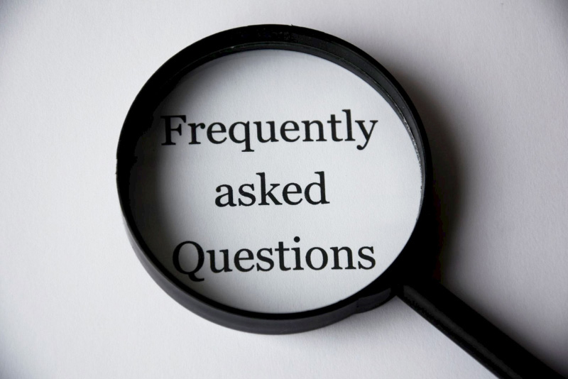 stock photo magnifying glass with words frequently asked questions