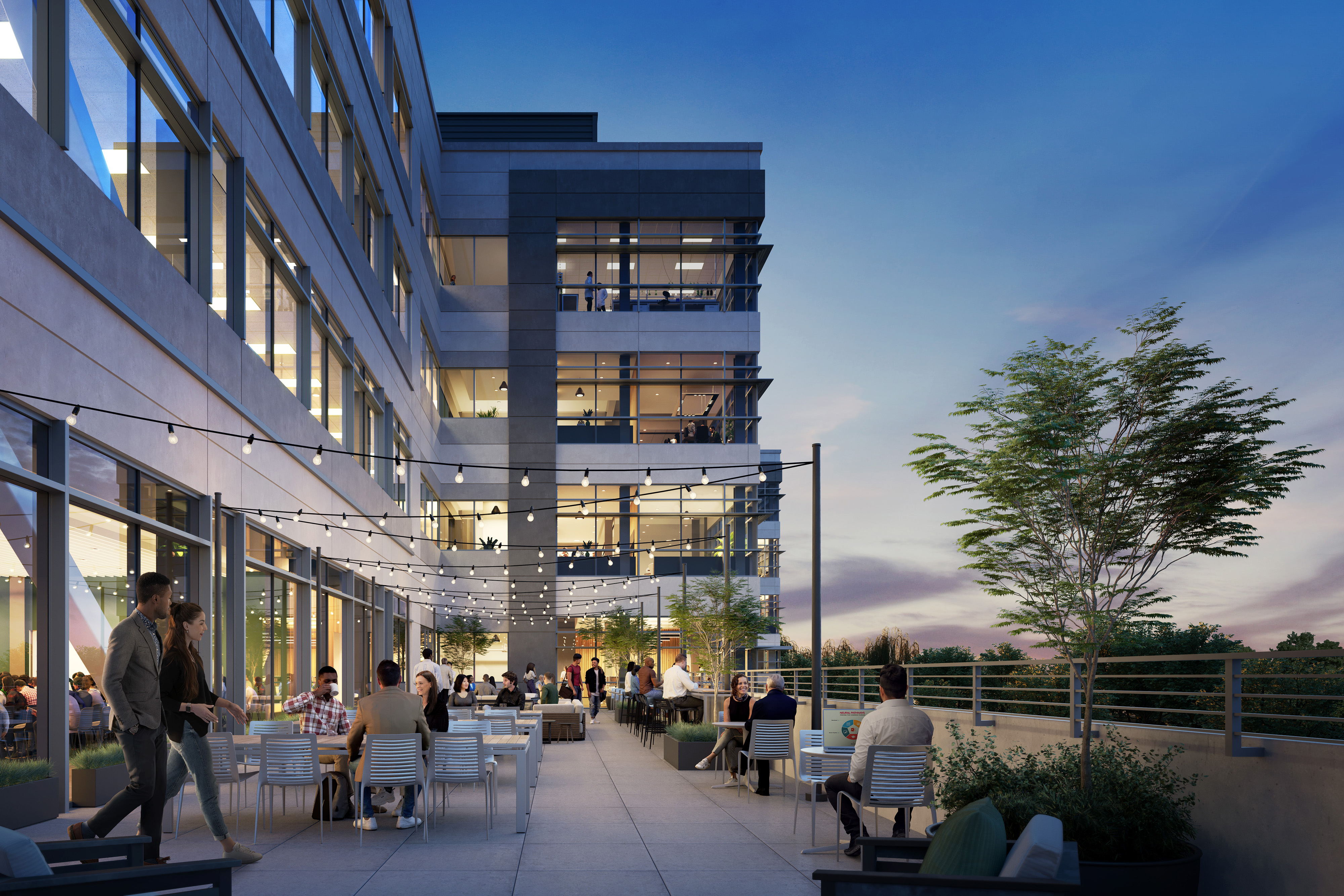 Side profile of building with people enjoying outdoor deck at dusk