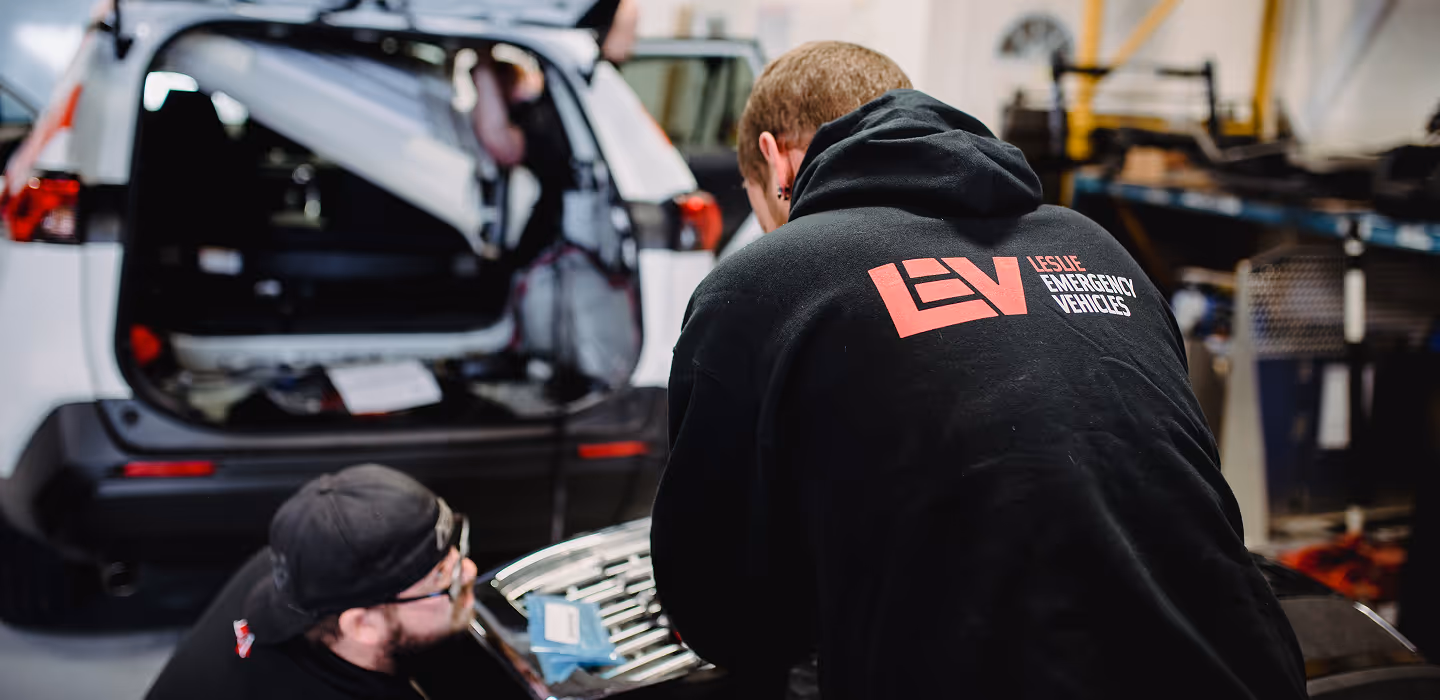 2 LEV Technicians Installing a new technology into an emergency vehicle.