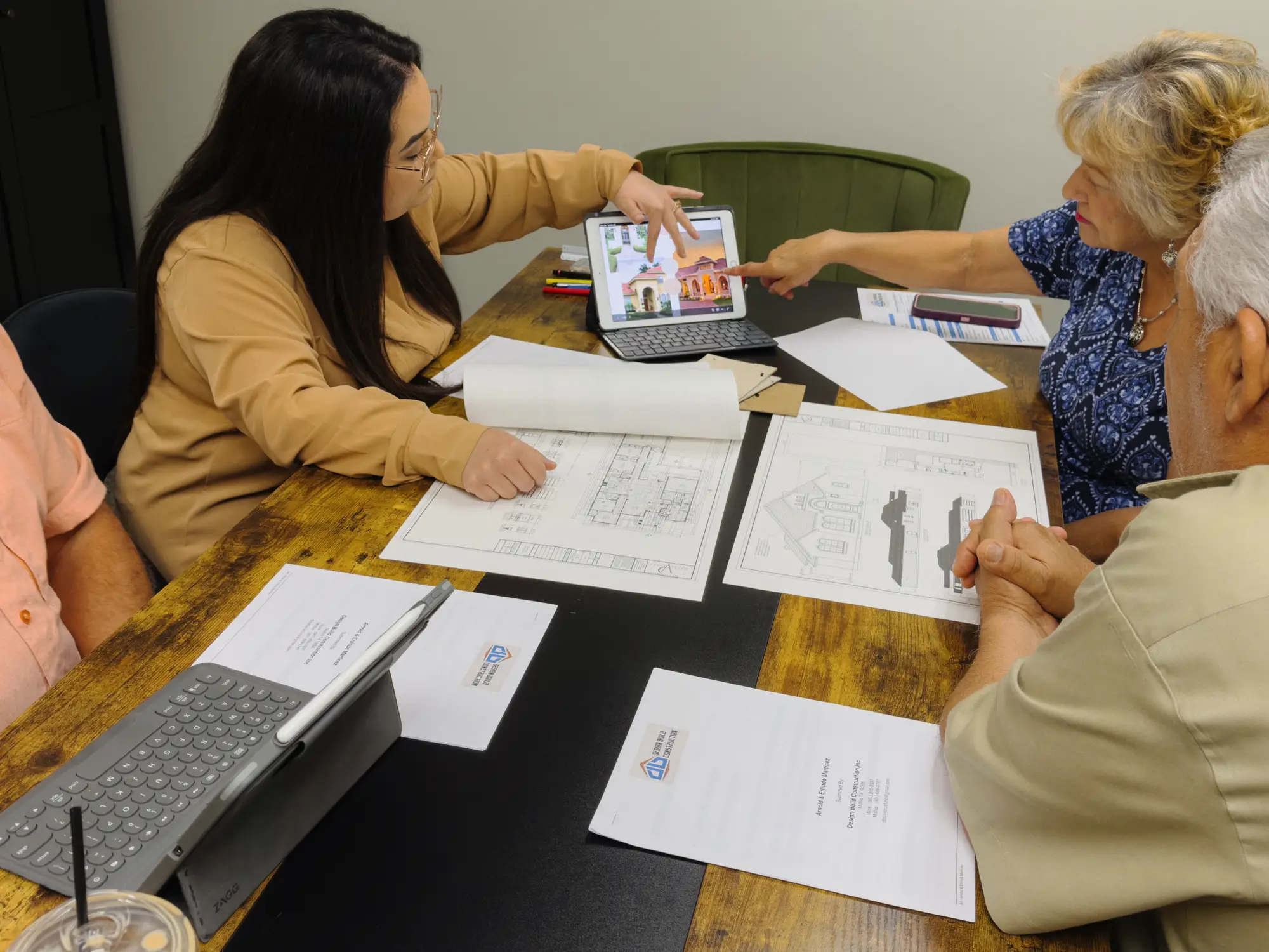 JD and Michelle meeting with client of their design