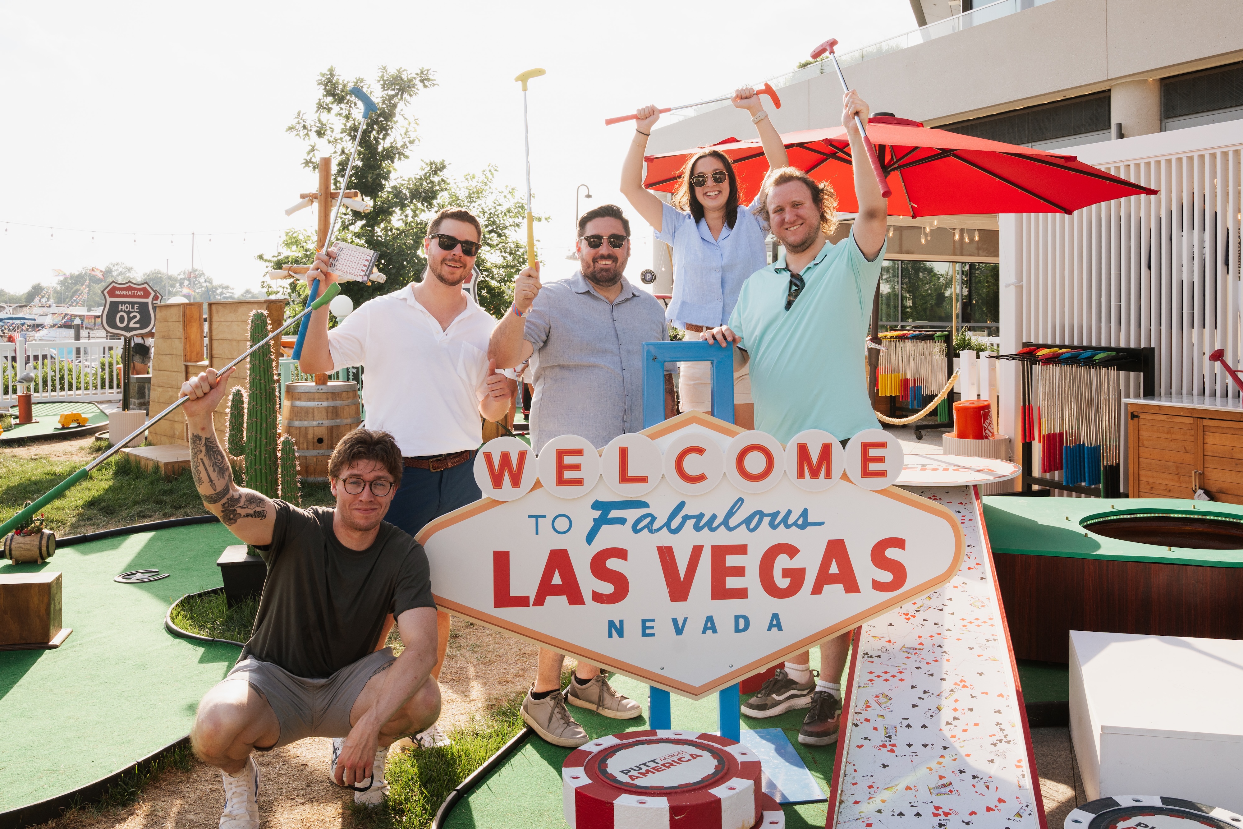 Group standing in front of the Las Vegas sign