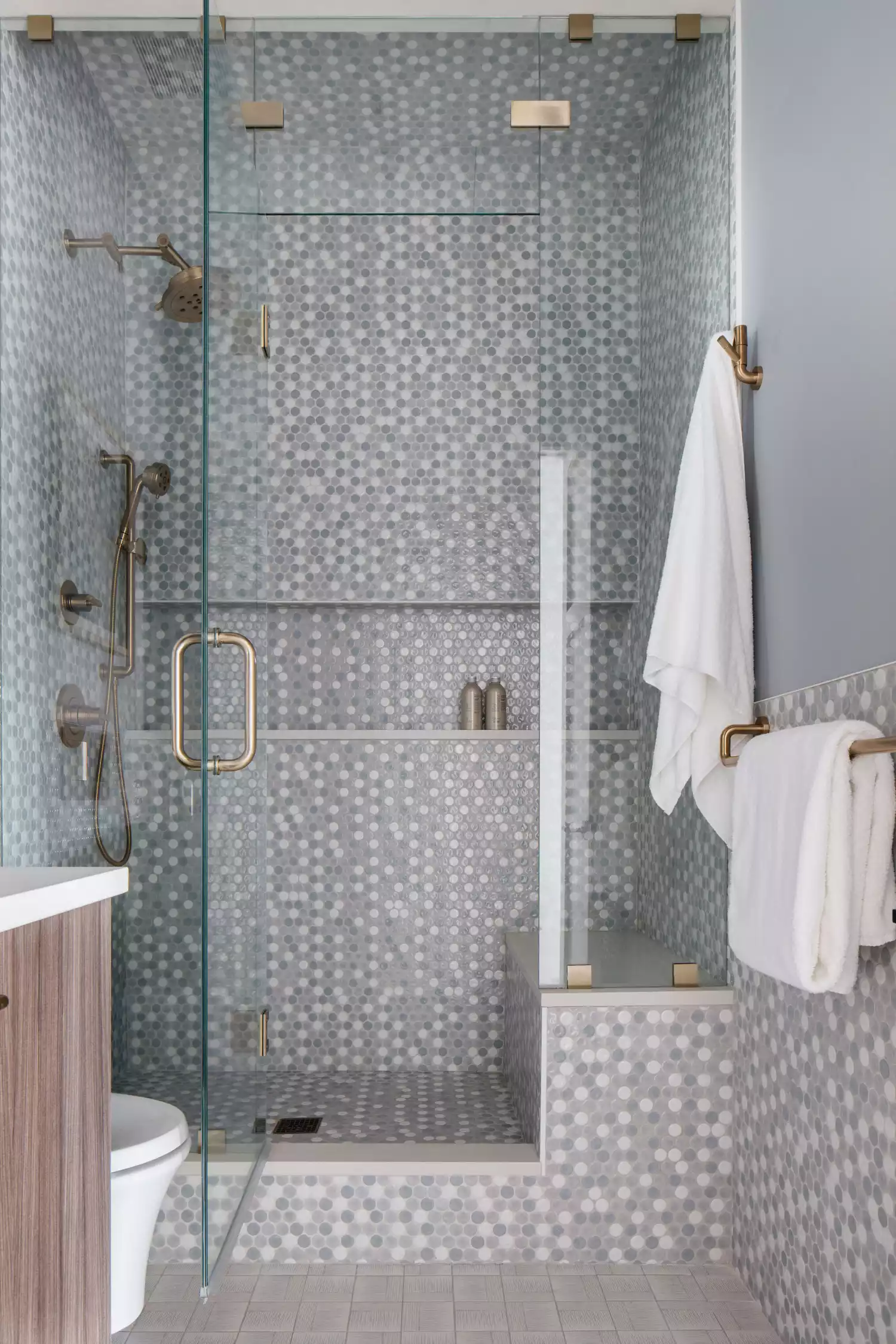 Gray small mosaic tile shower