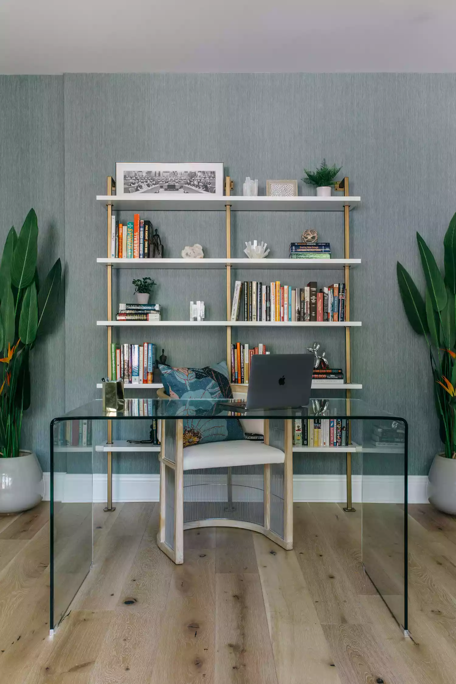 bookshelf with mismatched library arrangement