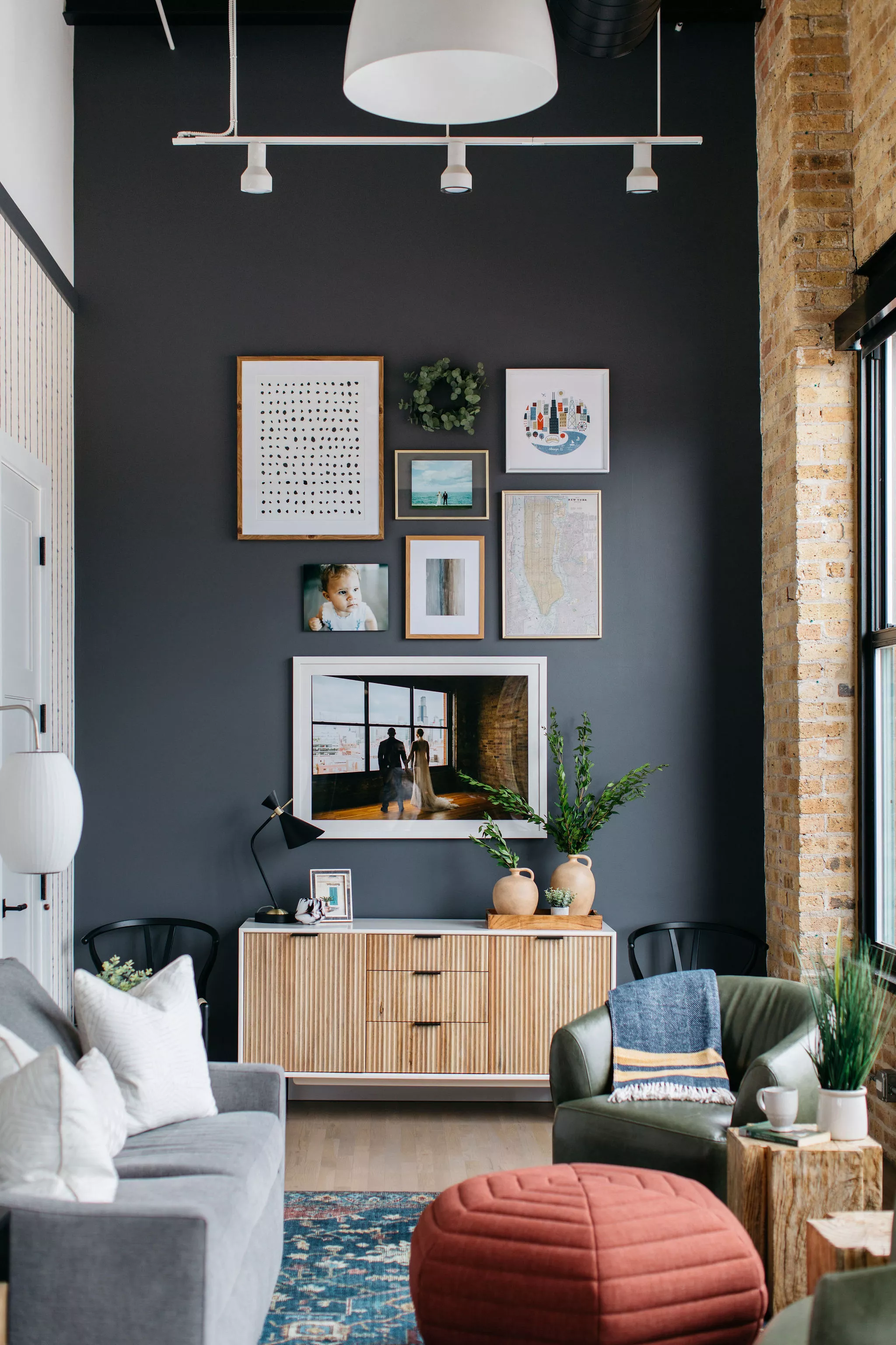 Living room with high ceilings and a gallery wall over a media console 