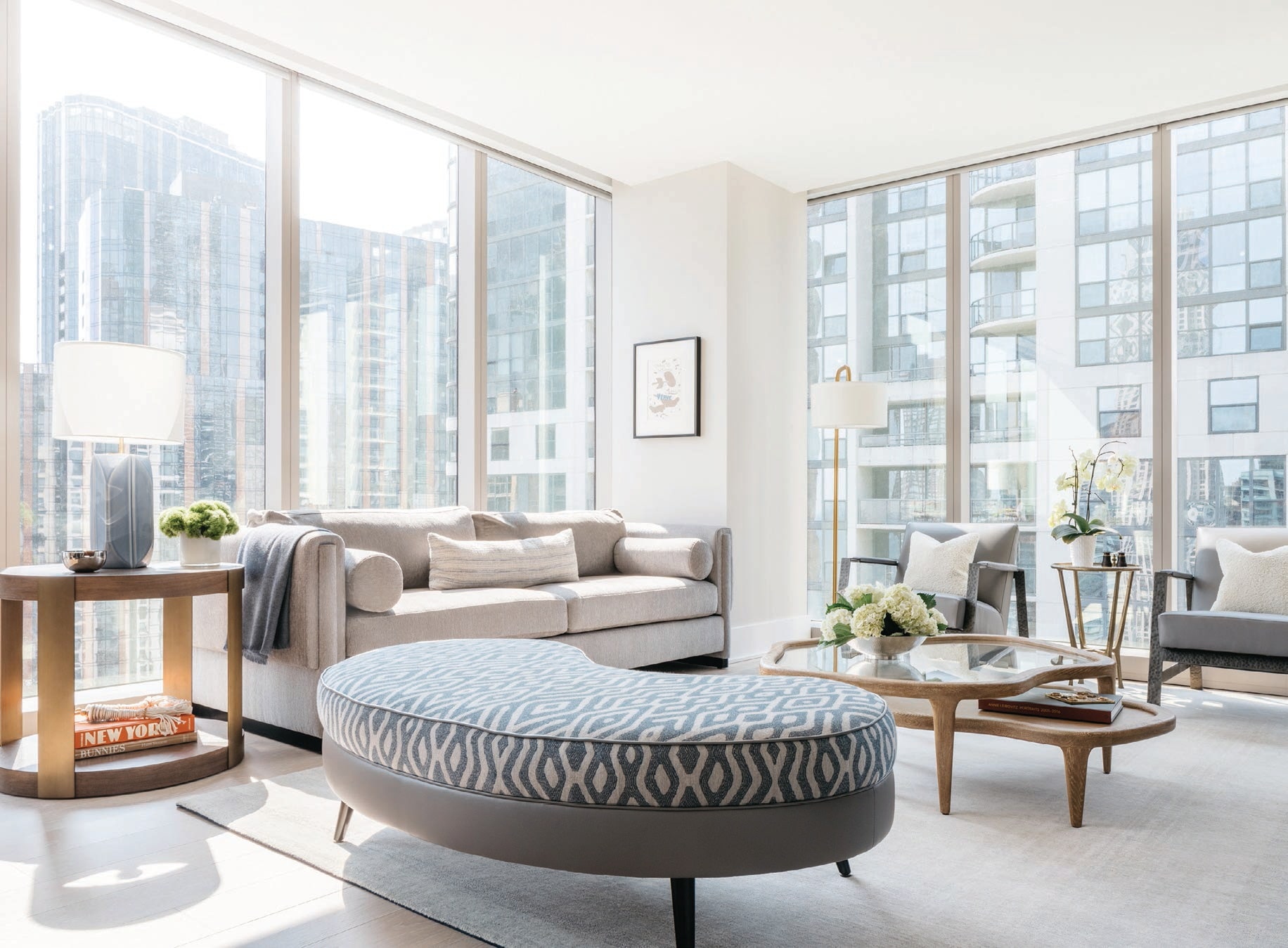 In the living room, a custom OI sofa with Great Outdoors fabric, table and floor lamps from Circa Lighting, and a Georges Braque artwork on the wall PHOTOGRAPHED BY MARGARET RAJIC