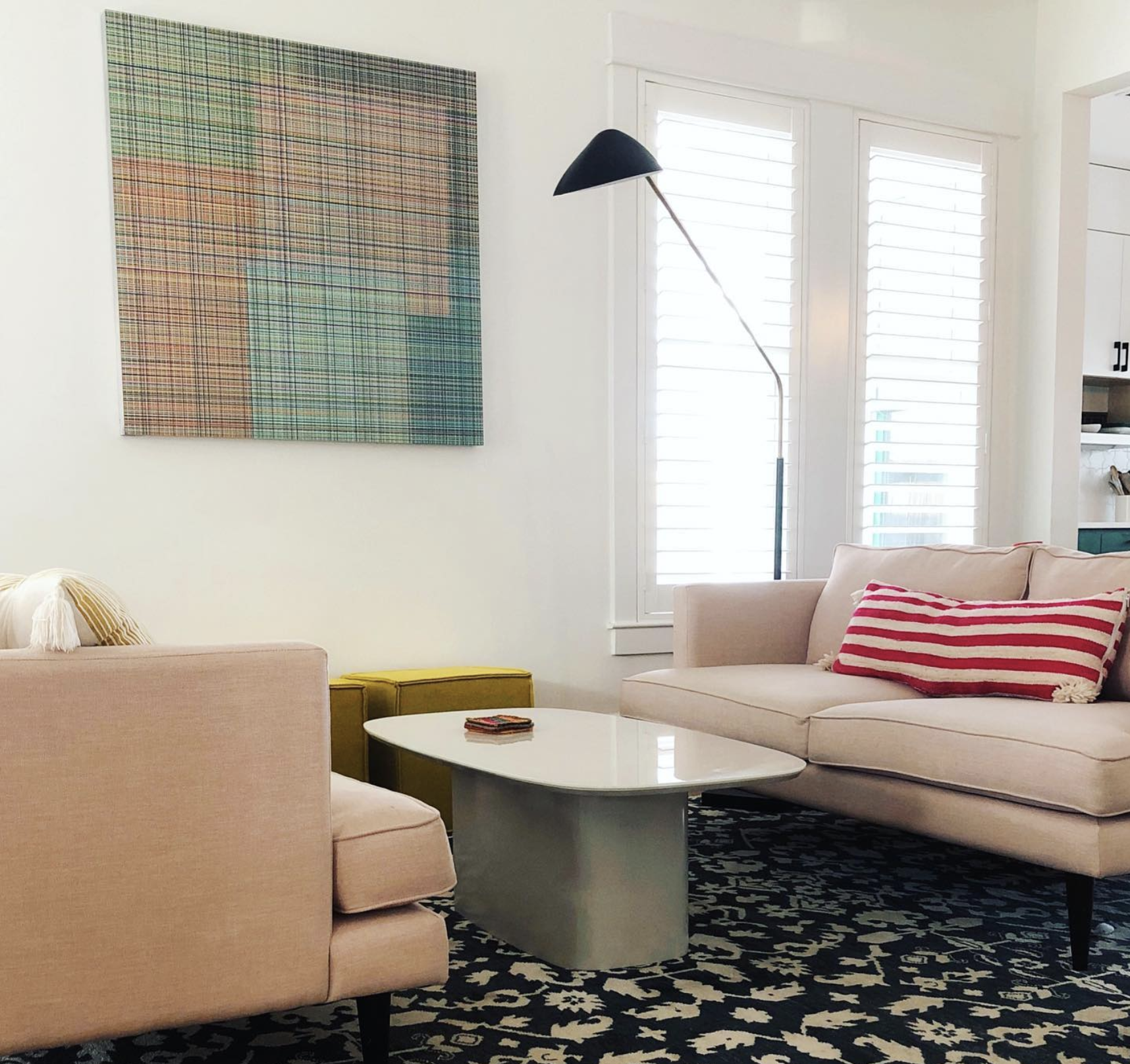 This cozy living room features well thought out selections in this well lit room.