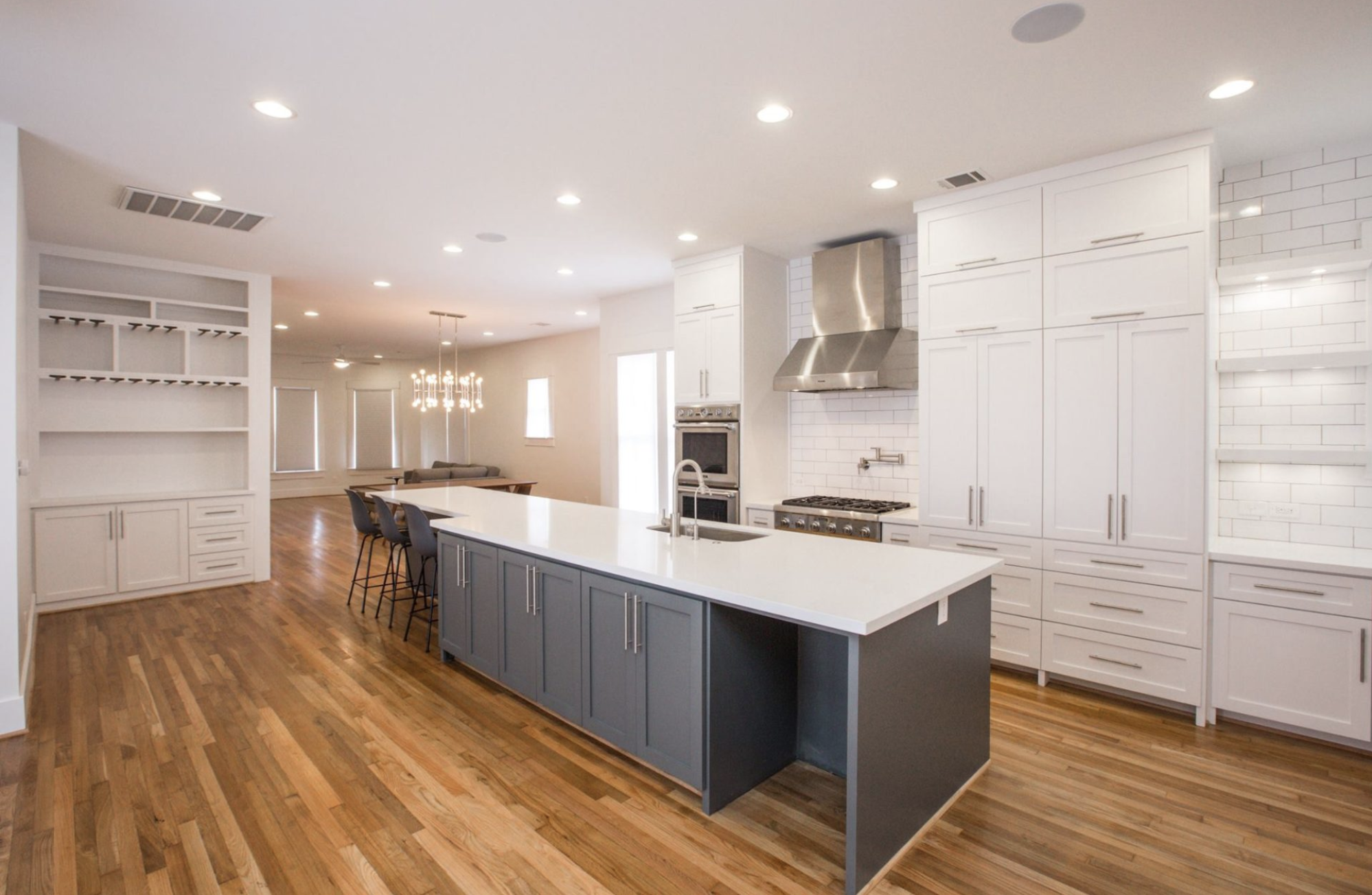 This kitchen renovation shines out with beautiful wood floors and clean craftsmanship.