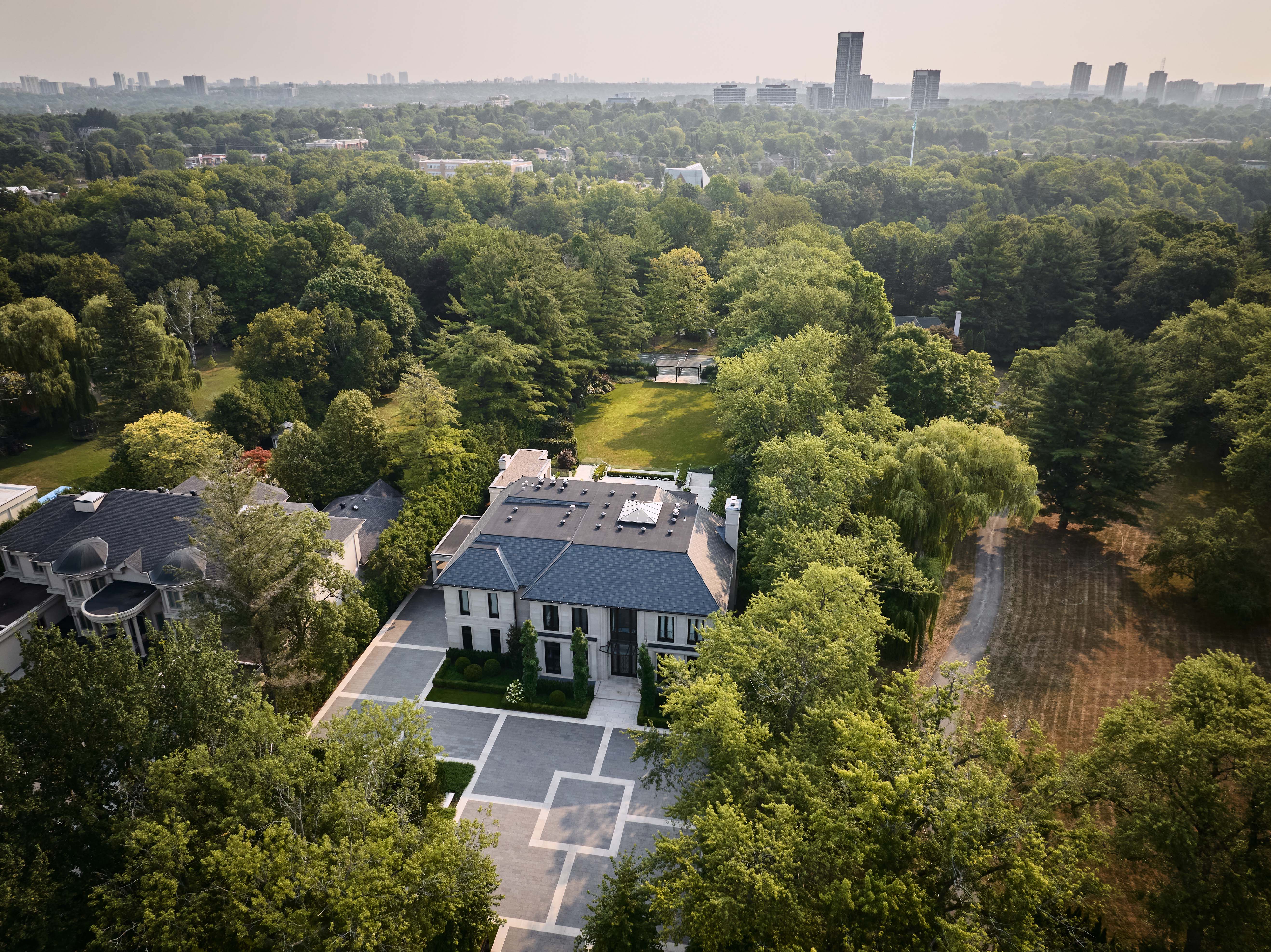 The entrance to the Bedford, with cars entering the car park.