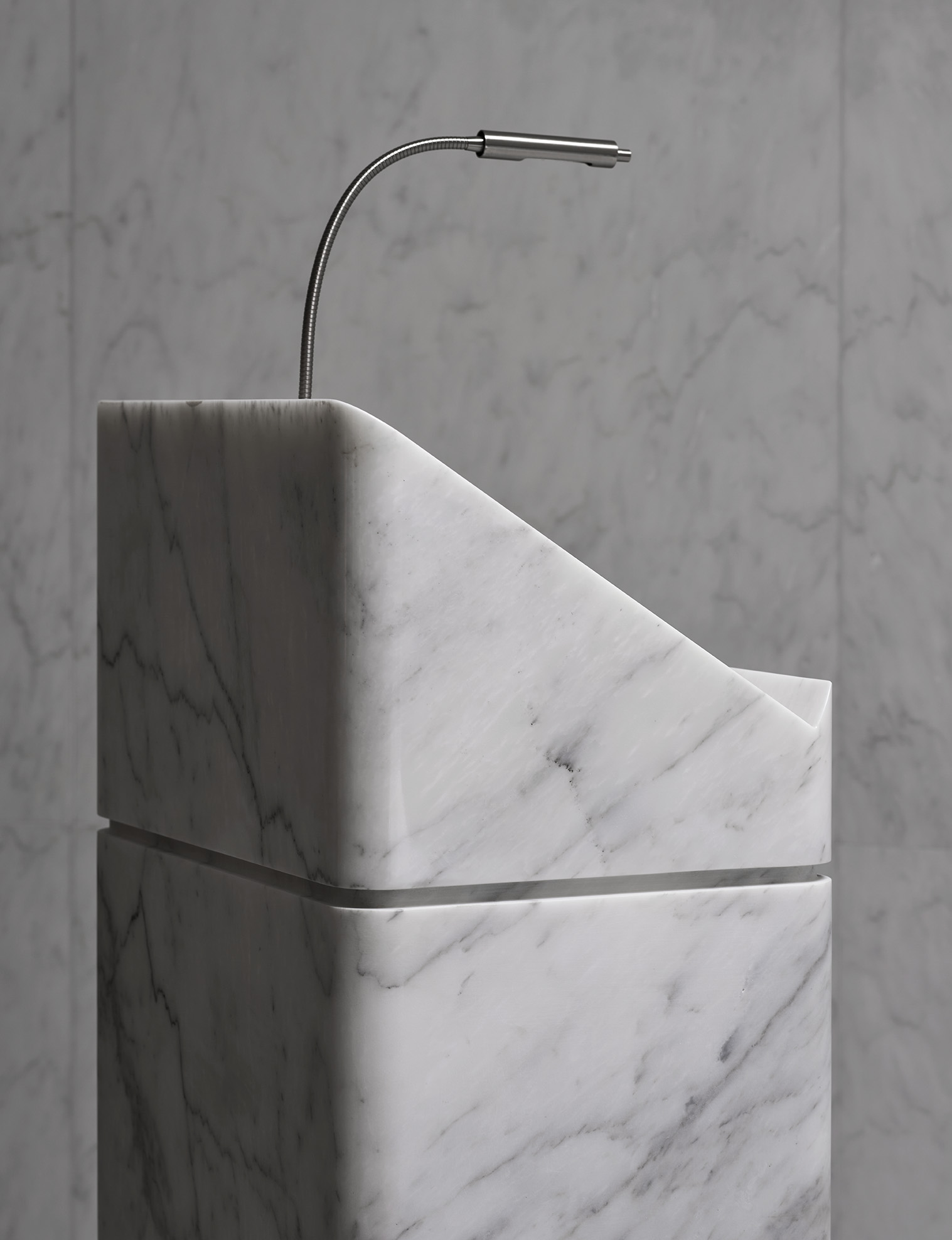 An outdoor dining table with white flower in the centre.