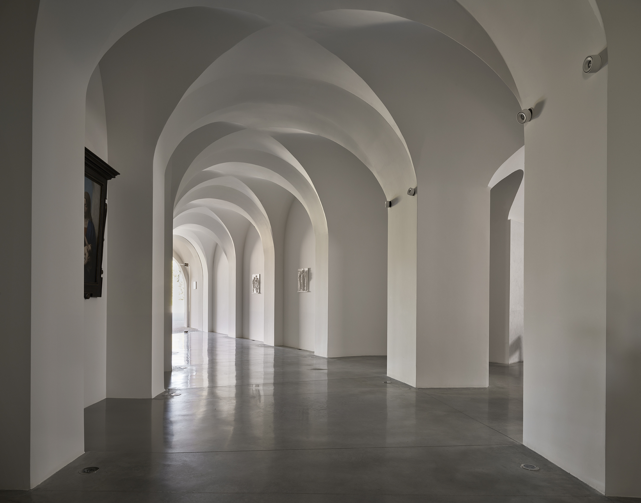 Woman sitting in front of 101 Spadina's entrance.