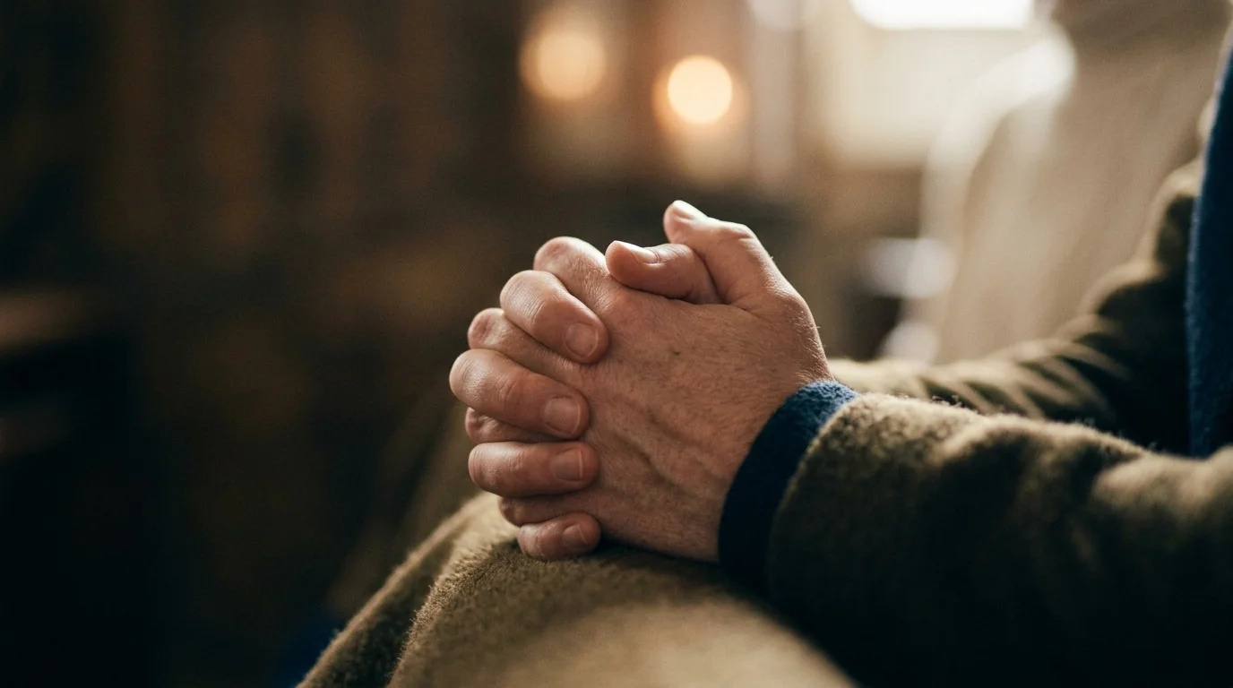 Hands folded in quiet Christian prayer posture