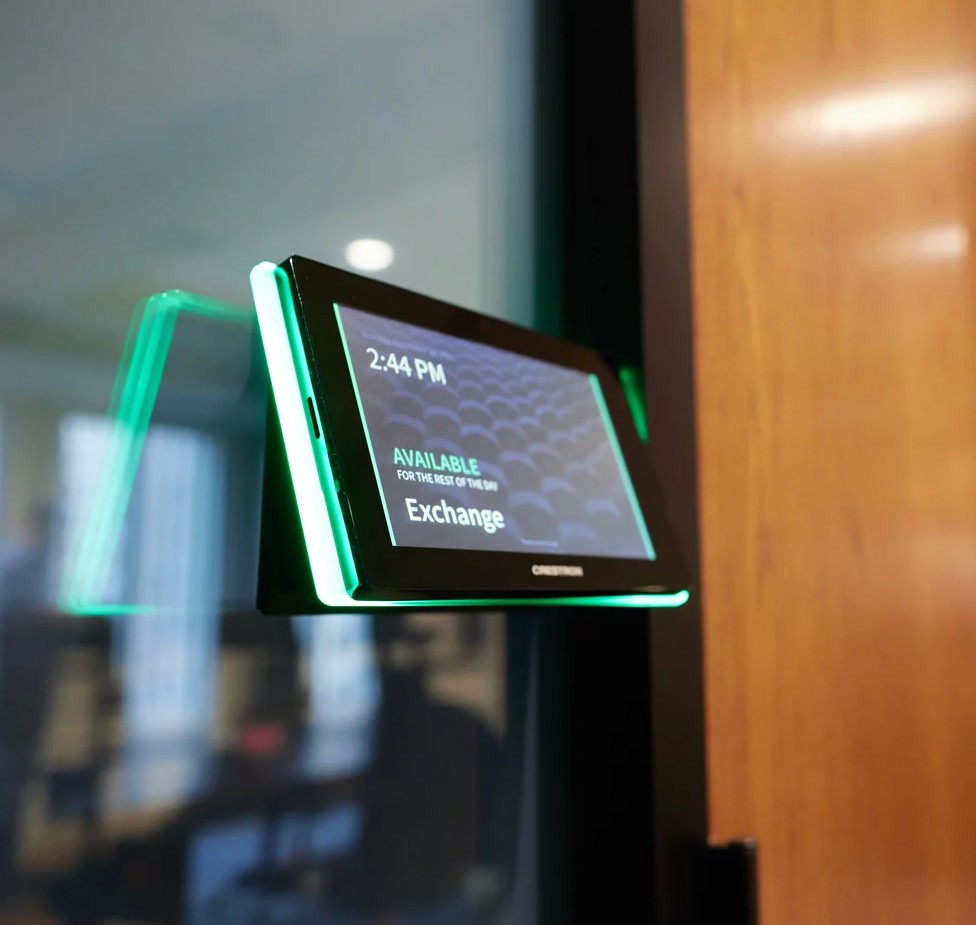 room scheduling device mounted on conference room glass