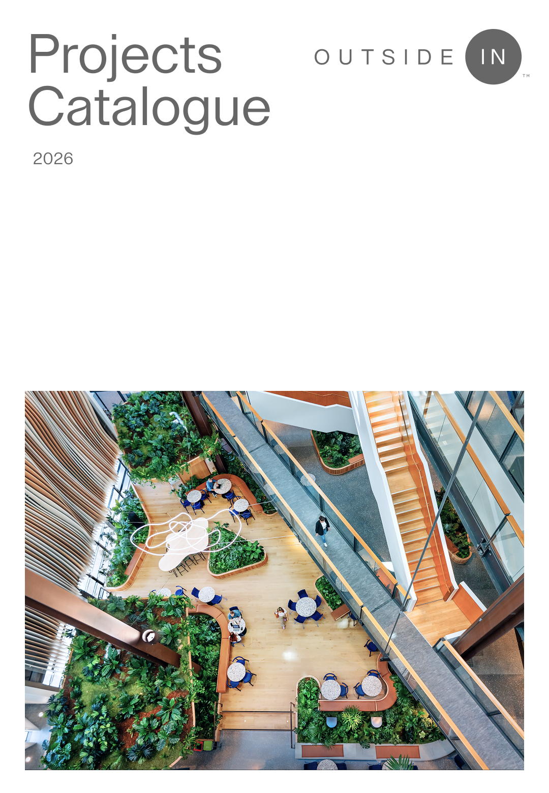 Top-down view of a modern indoor space with wooden floors, green plants, round tables with blue chairs, a staircase, and a glass railing, titled 'OUTSIDE IN' with the year 2026 below.