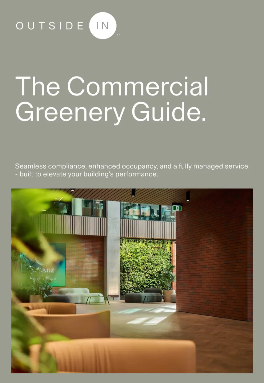 Cover page titled 'The Commercial Greenery Guide' by Outside In with a tagline about seamless compliance and fully managed service, featuring a modern indoor lobby with comfortable seating and a vertical green plant wall.