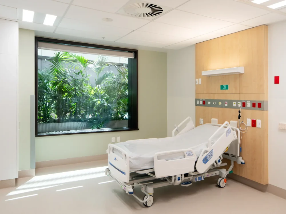 Hospital recovery room with a large window looking out onto the Healing Garden planting