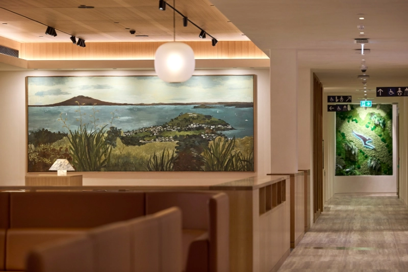 Landscape painting and moss wall at the Qantas International Business Lounge, Auckland