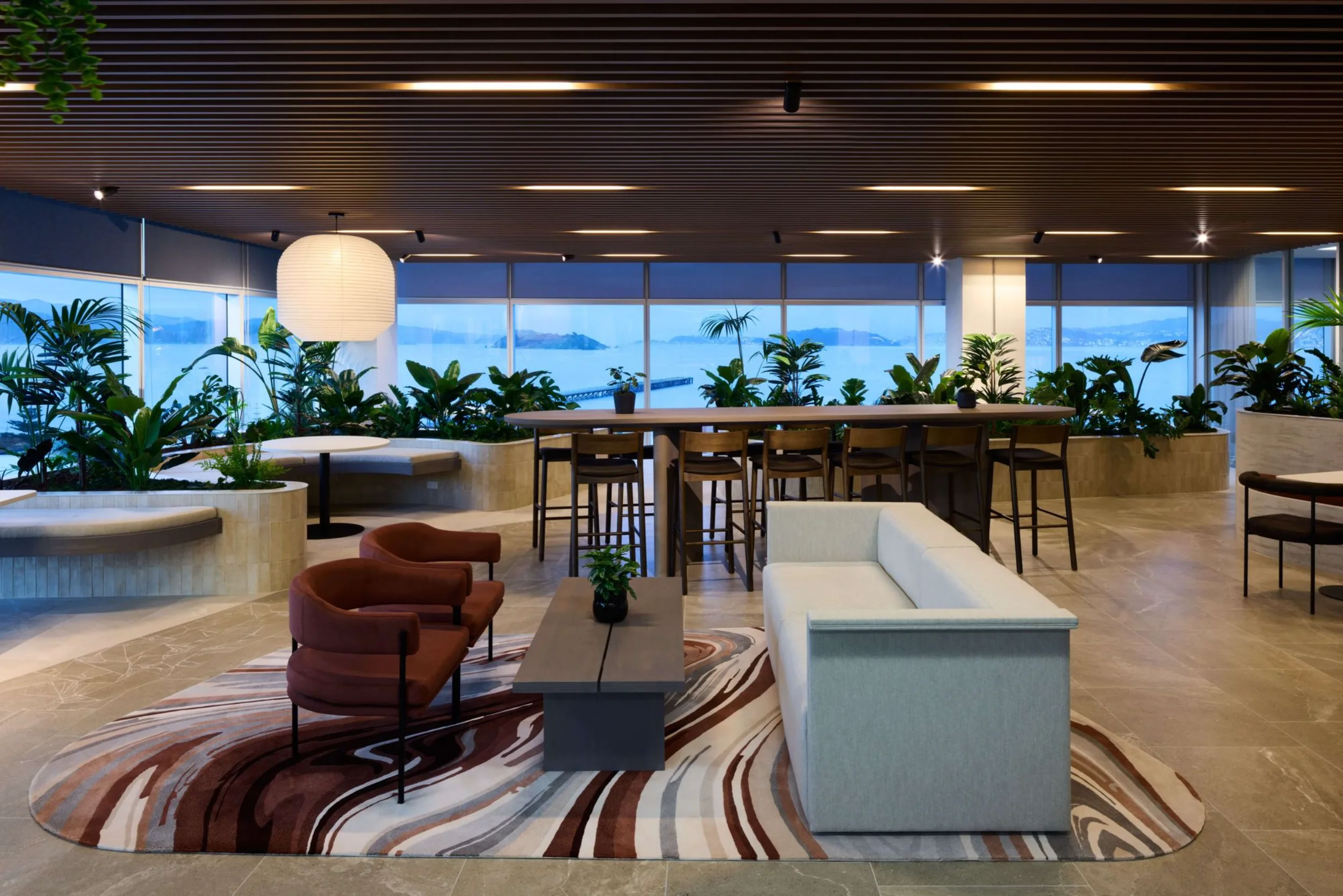 Thoughtful greenery brings calm and connection to this secure workplace environment.