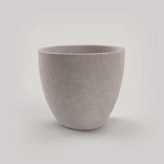 Terra Curve tapered planter with an erosion-textured finish