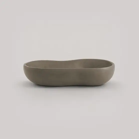 Geode smooth biomorphic planter in a weathered stone finish