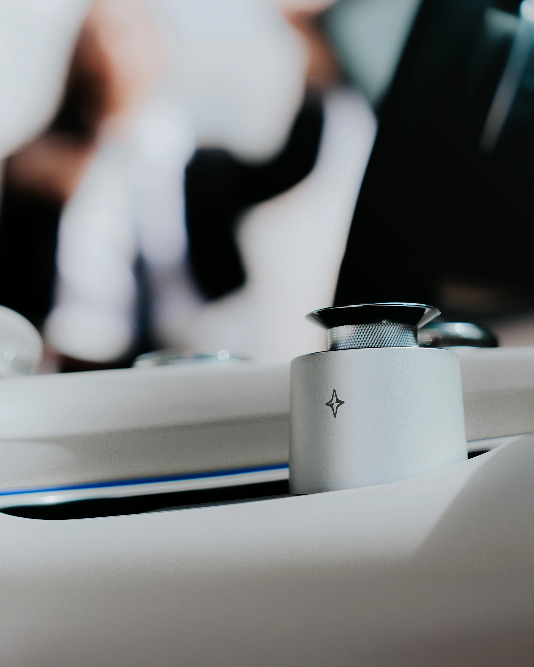 a person getting into the car and focus on the air diffuser the vessel in the cup holder in warm and sunny day