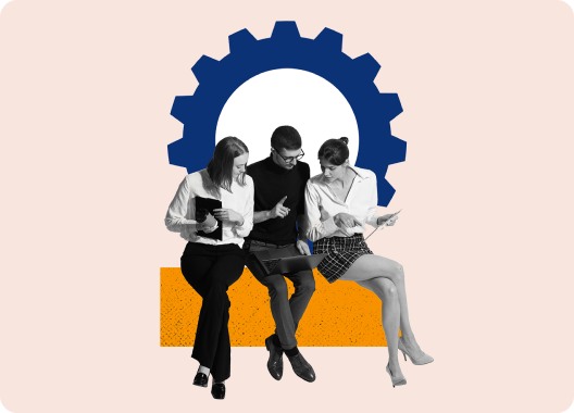 Three colleagues discussing work behind an illustrative symbol of a gear.