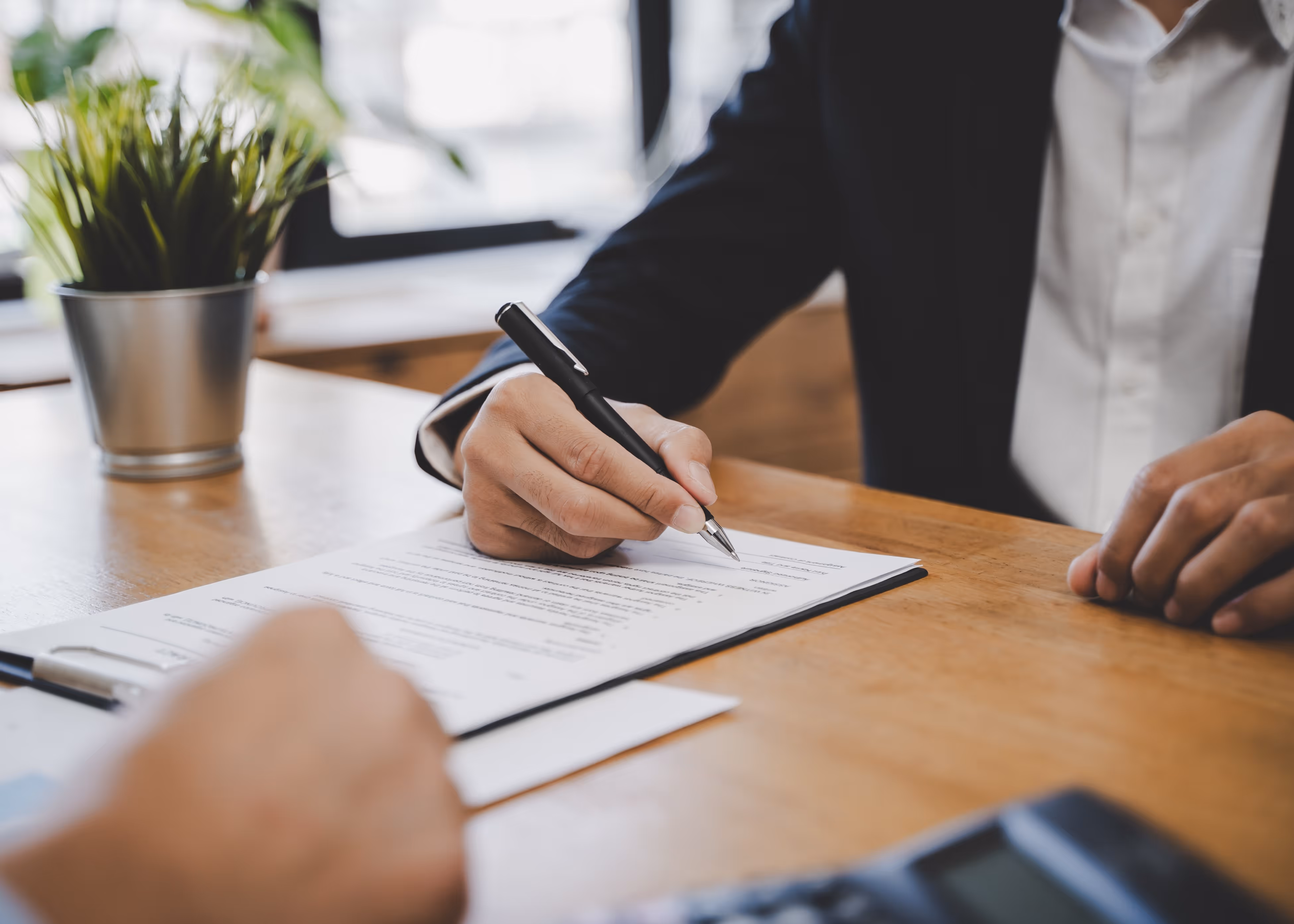 hand holding pen writing