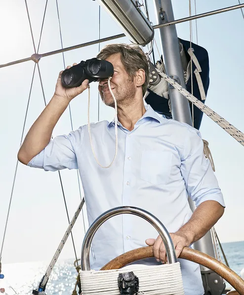 A white male with a white shirt looking at the horizon
