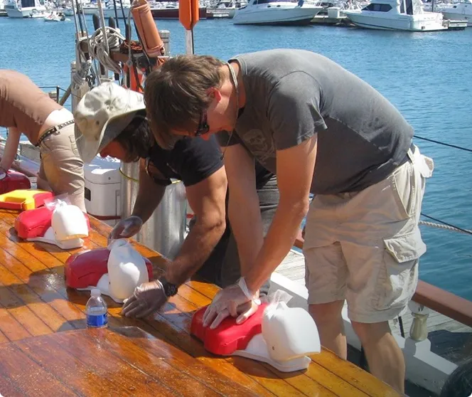 People on a boat doing CPR training