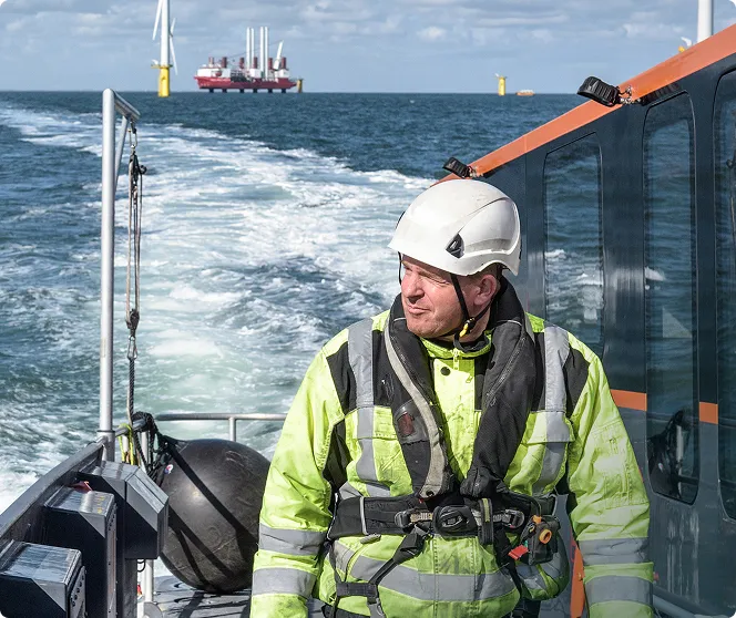 Person in safety gear on a large vessel