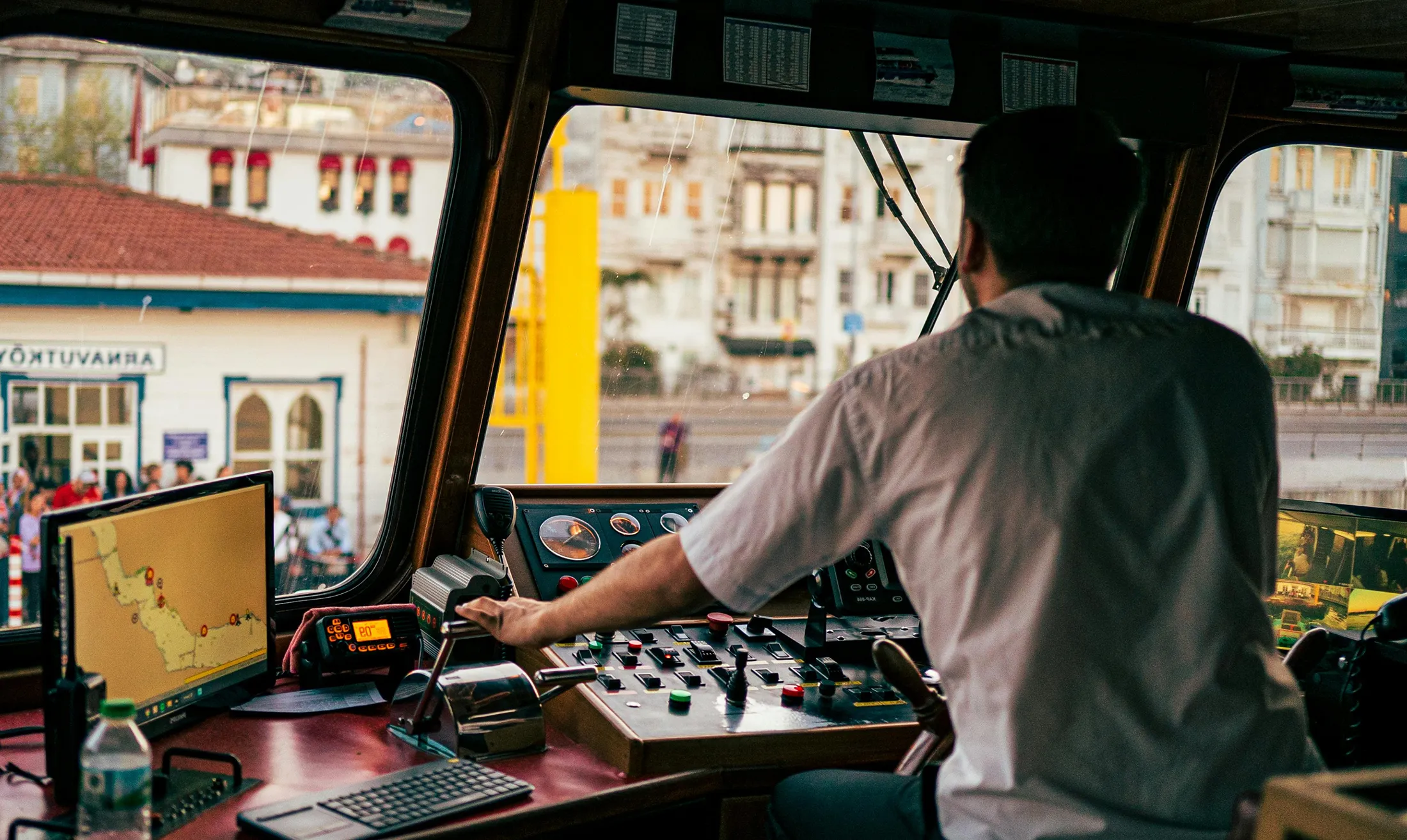 A male driving a boat