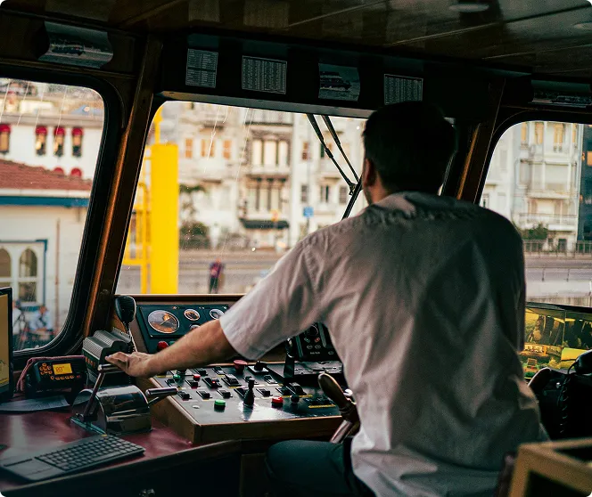 A male driving a boat