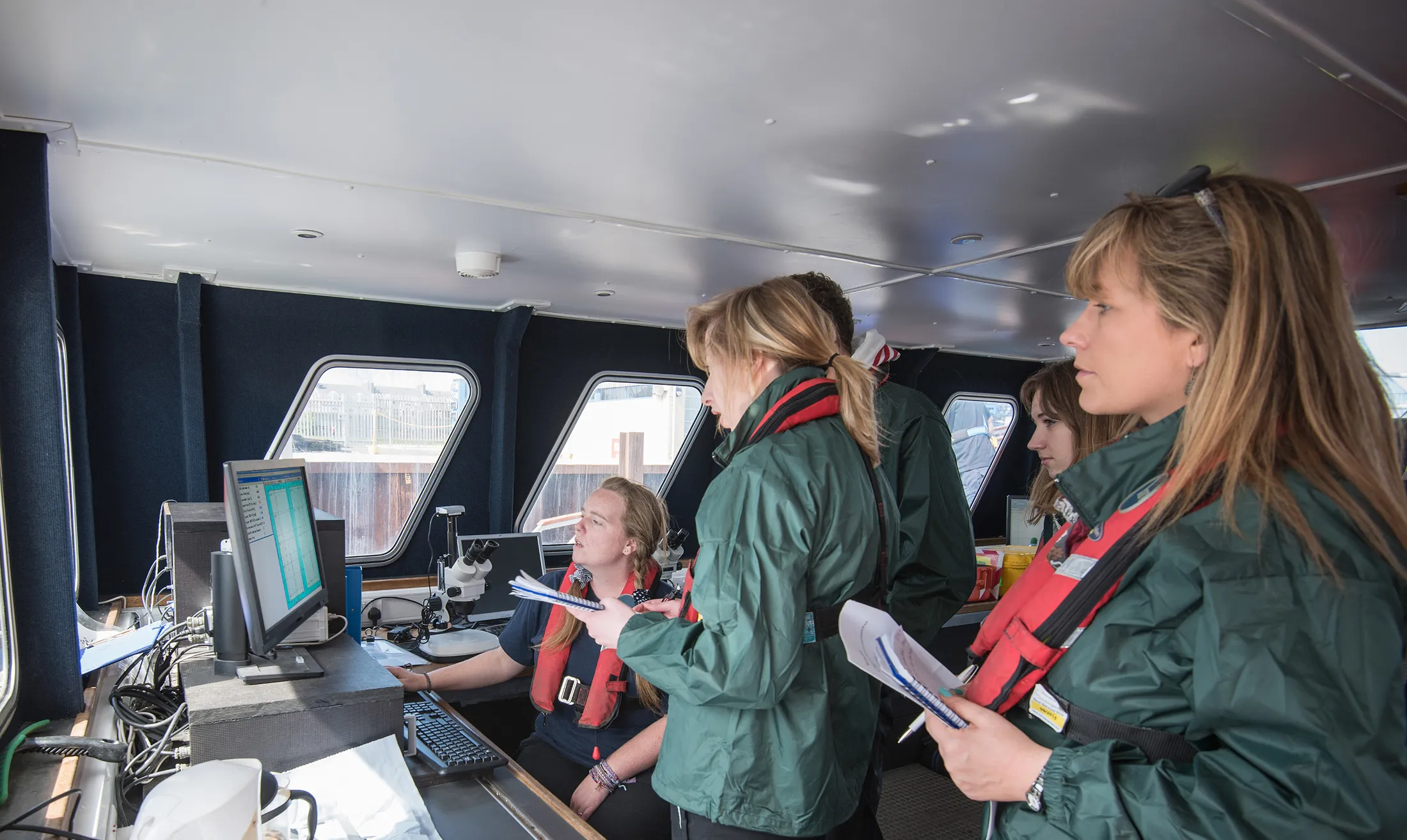 Four females in a boat cabin