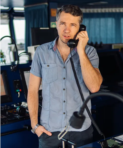 Person in a ship cabin talking on the phone