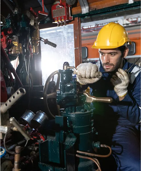 Person in the engine room with safety gear