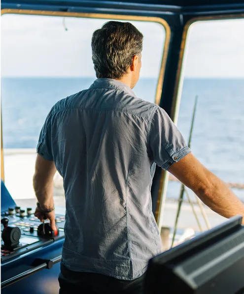 A male with a shirt on a boat